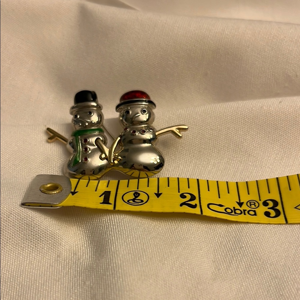 Festive Silver Snowman Brooch with Red and Black Hats